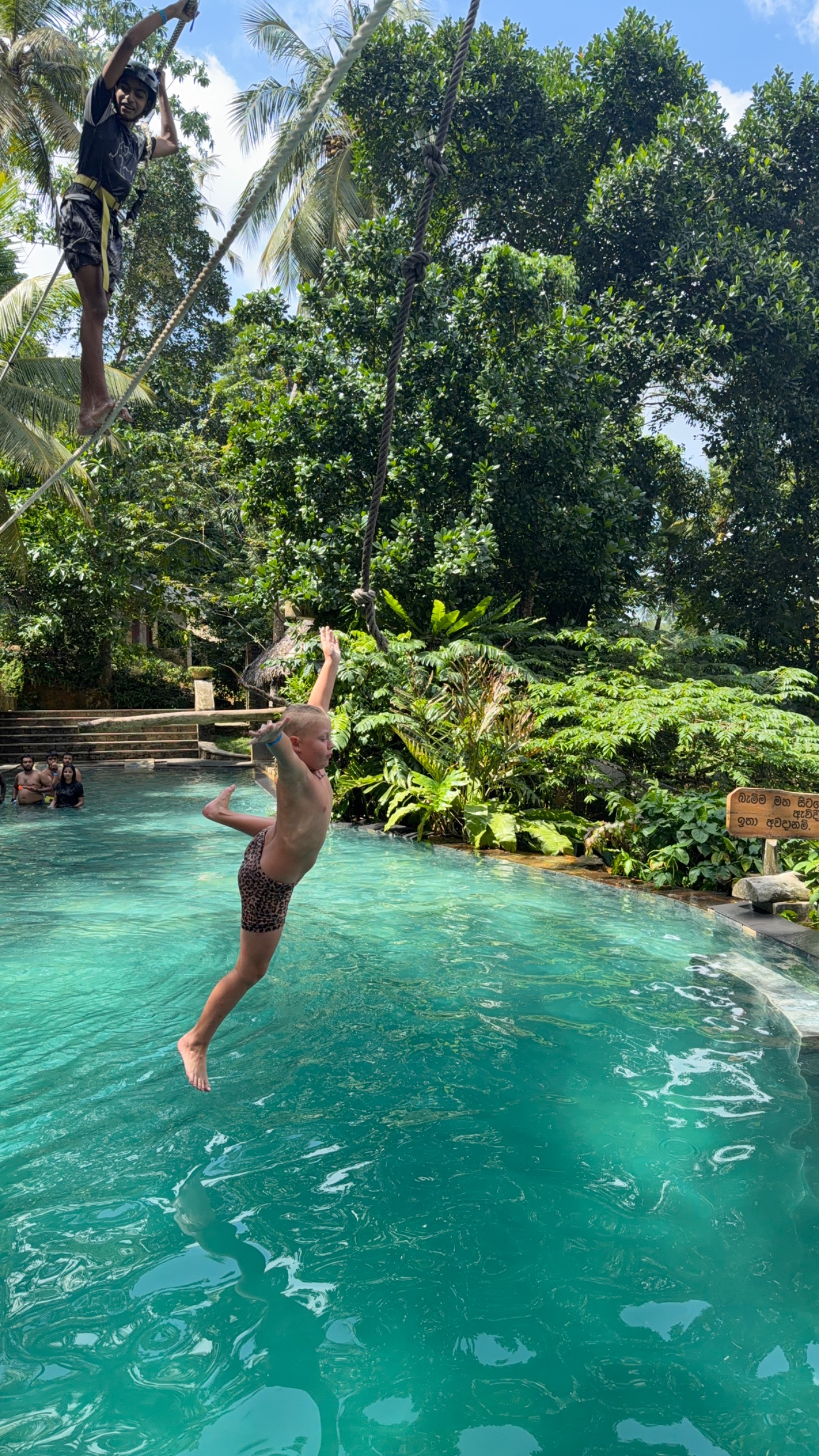 Jax rope swinging at the wild water park