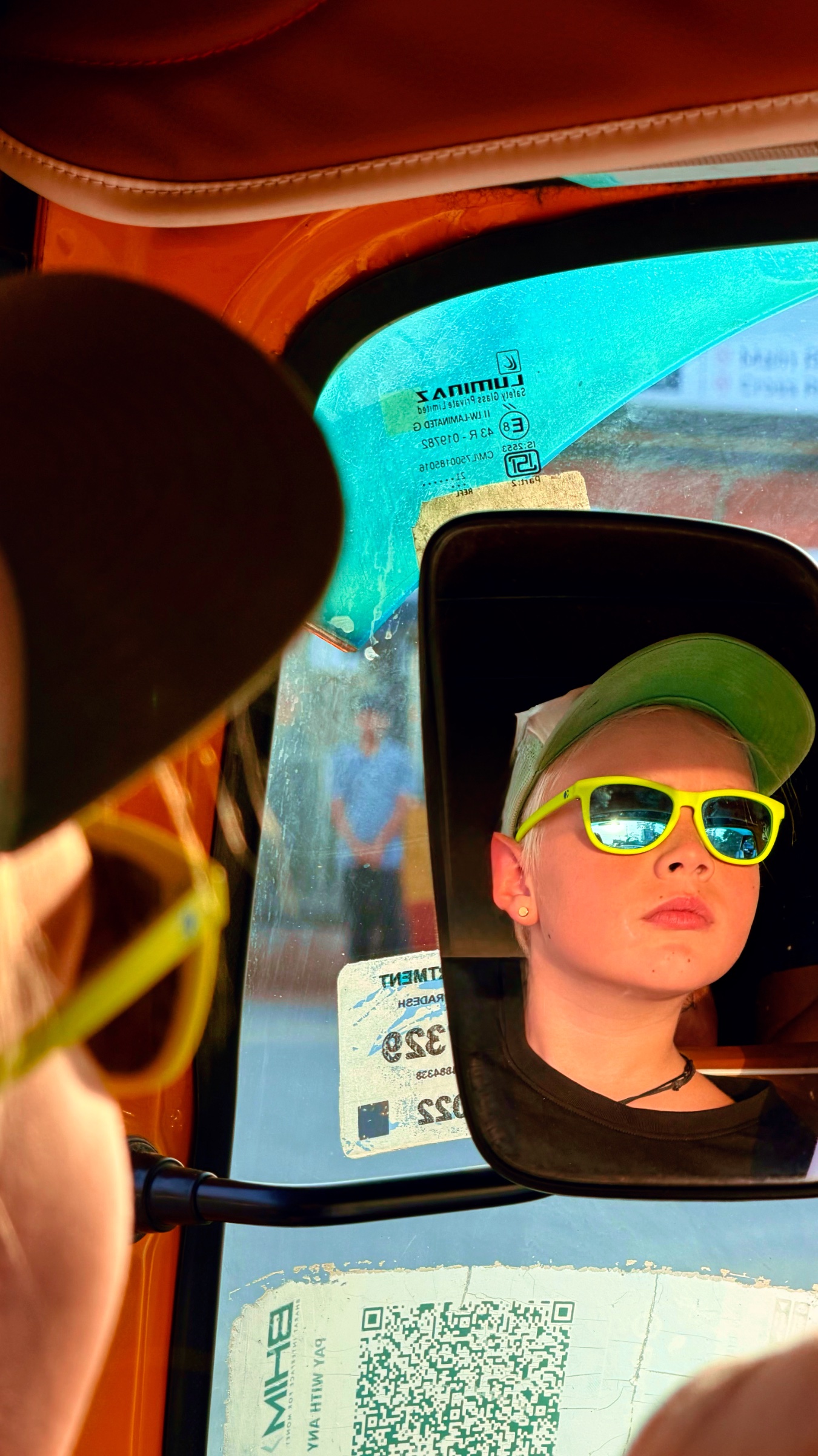 Jax riding in TukTuk with Sun on his face